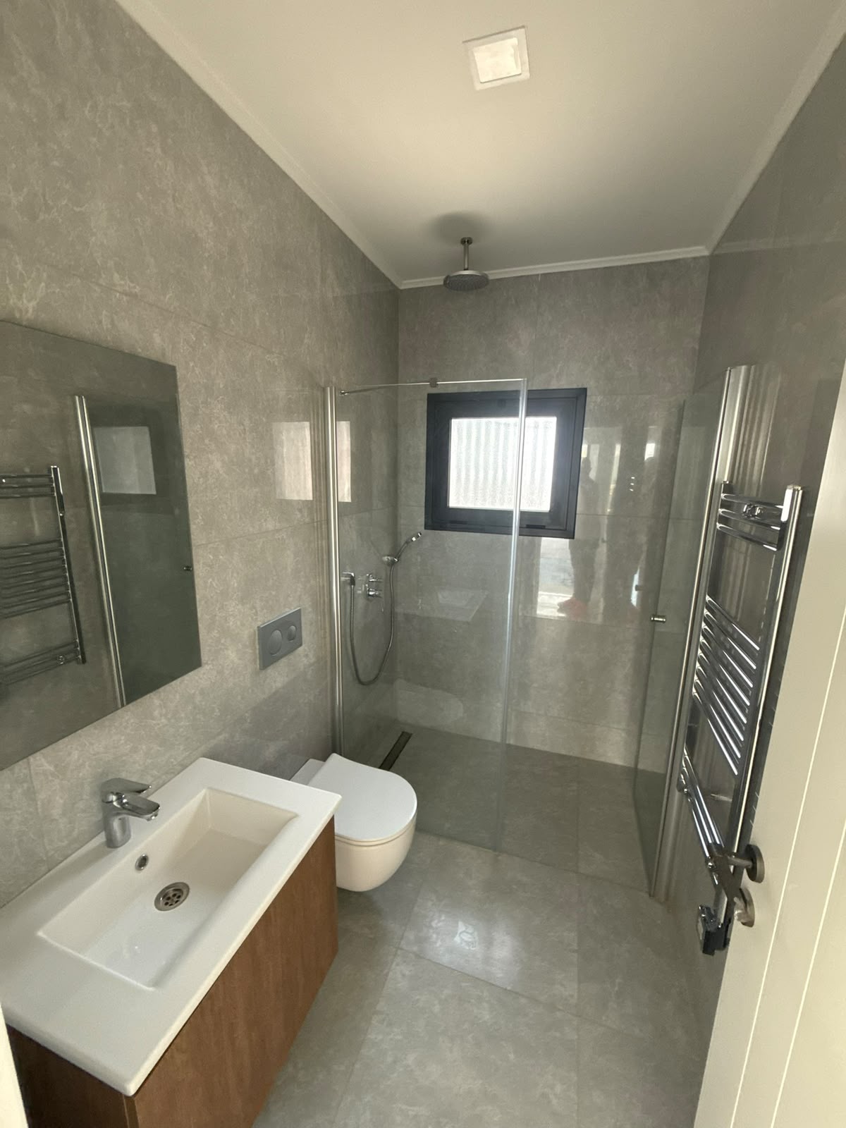 Bathroom: toilet, window, and sink