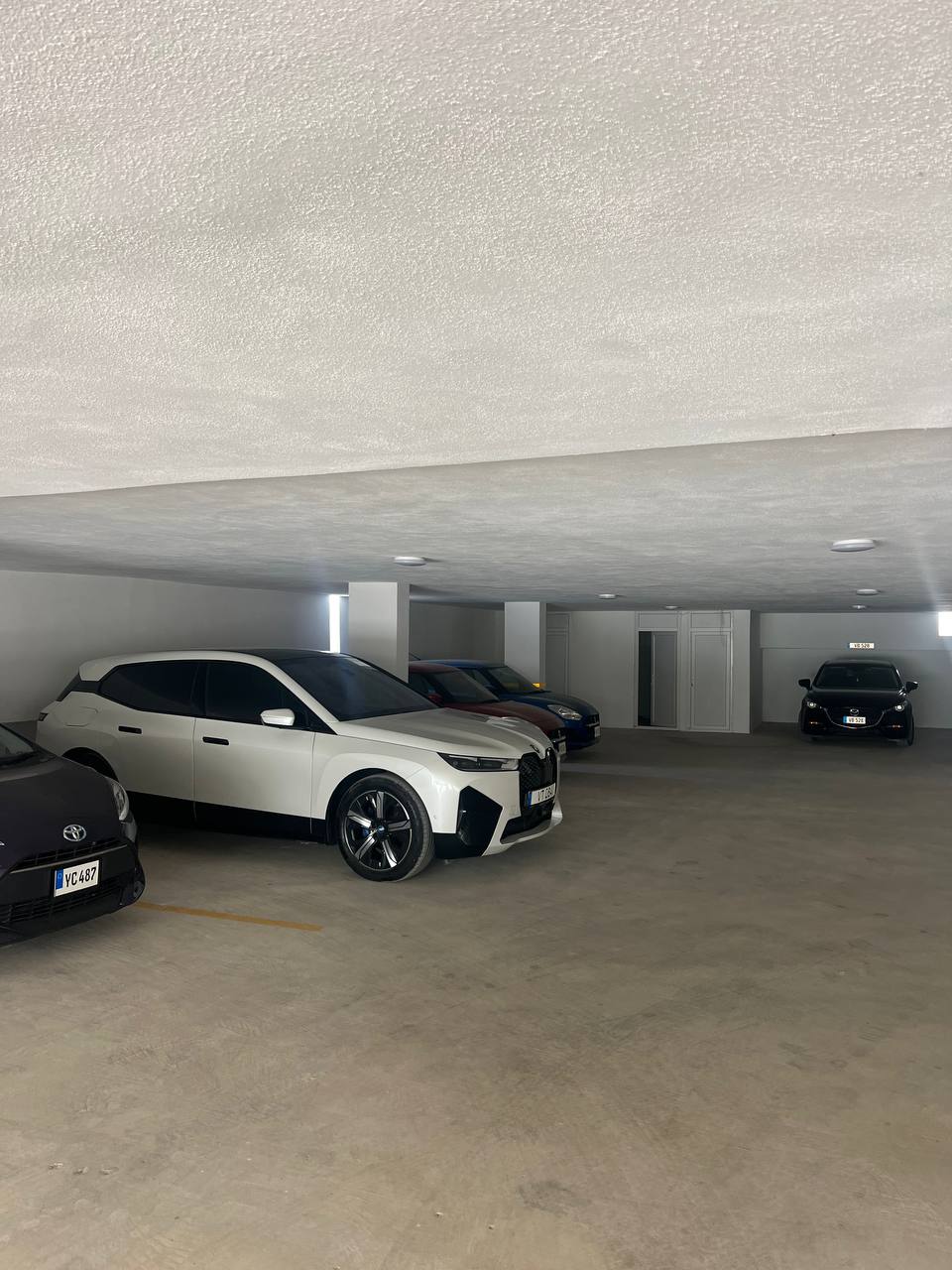 Underground parking of the Coliseum Court complex with resident parking spaces