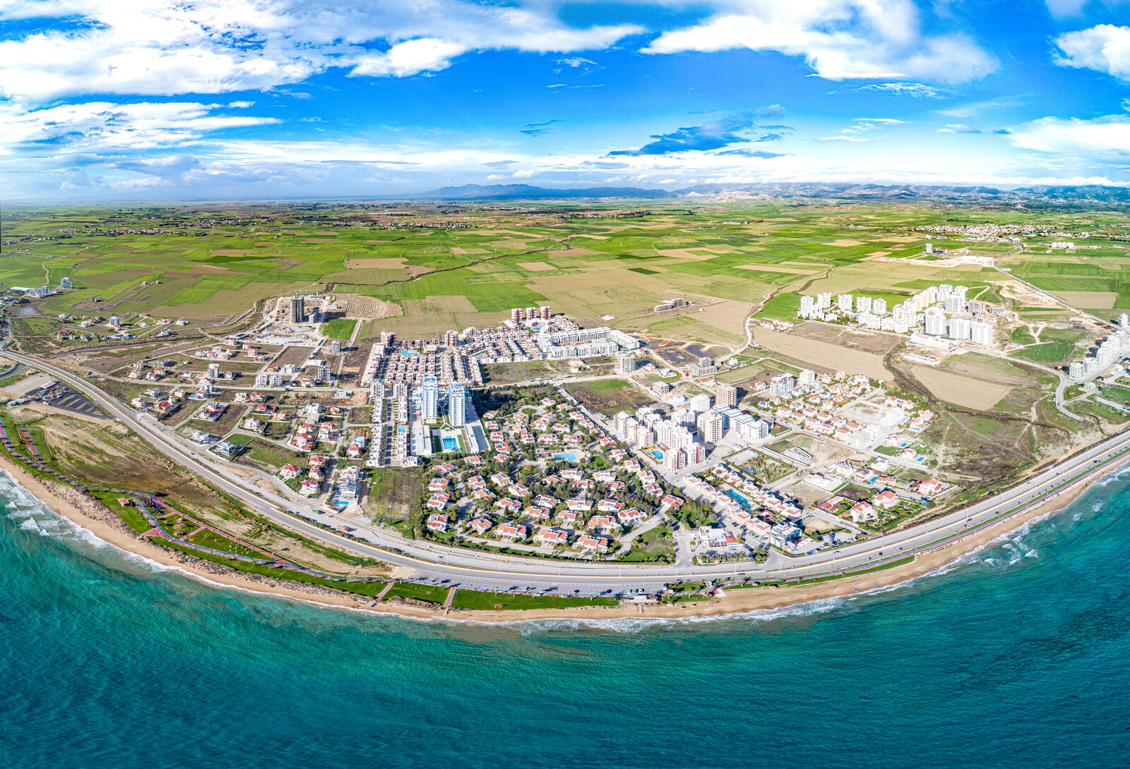 Aerial panorama of Long Beach: the sandy beach, the promenade and the Iskele coastline