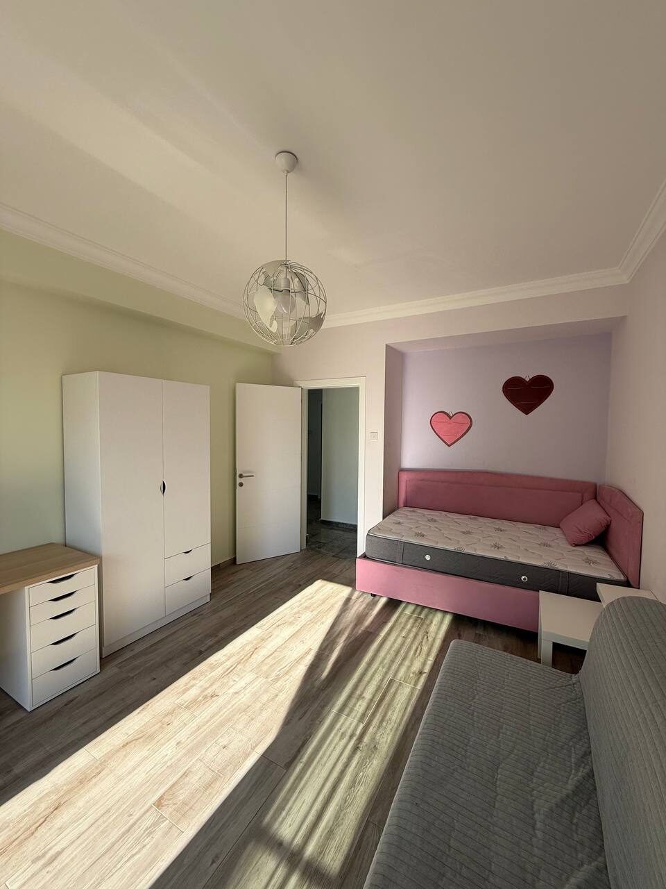 Child's room with a fitted wardrobe and chest of drawers