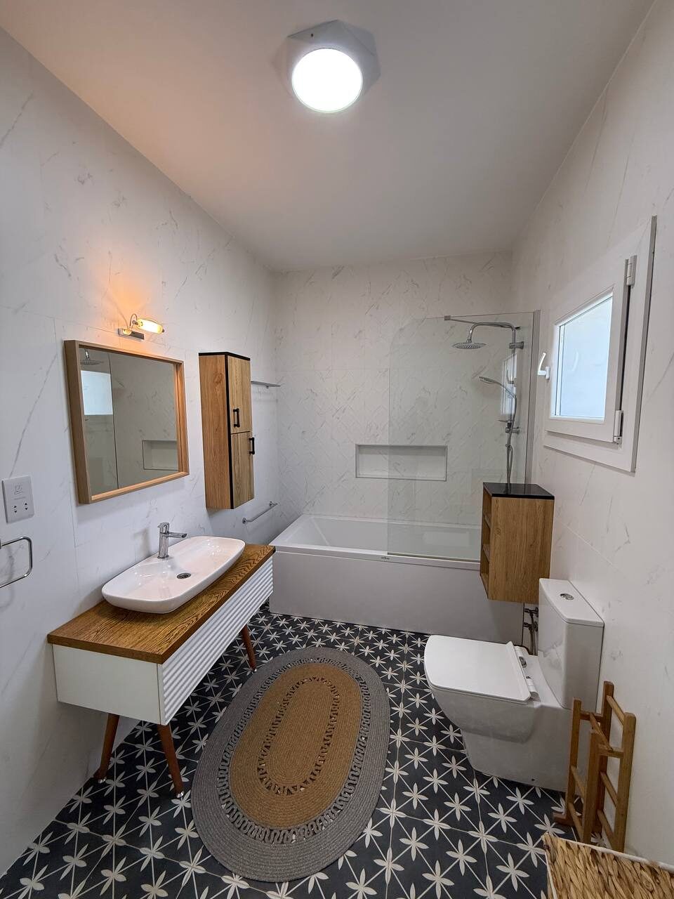 Bathroom: shower, basin and mirror