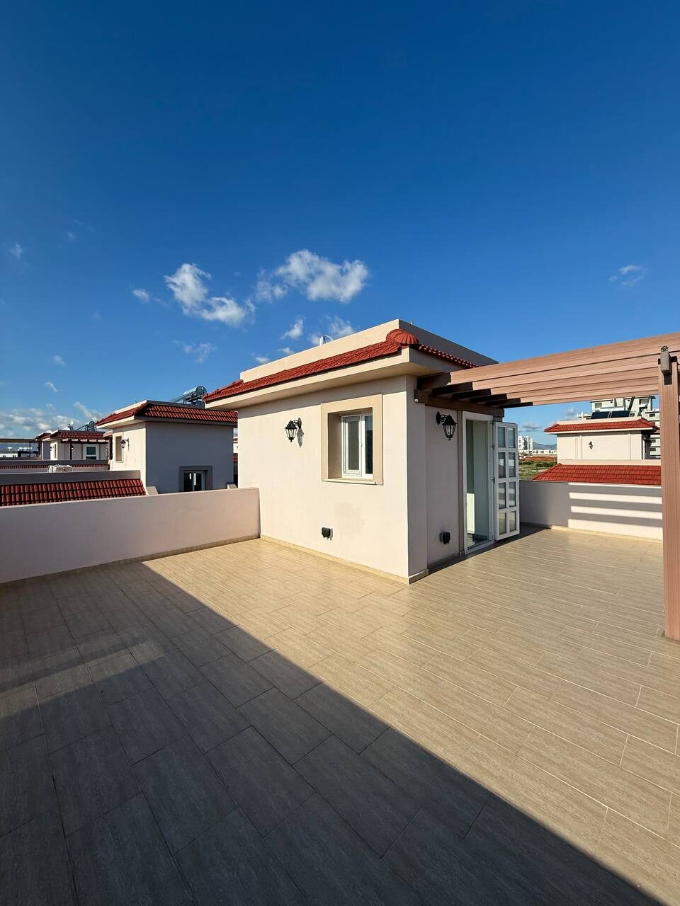 Roof terrace with a view of the neighbouring villas